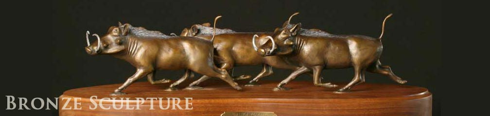 wart hog herd desktop bronze